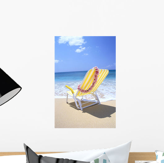Back View Of Yellow Beach Chair In Sand Wall Mural