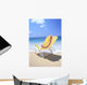 Back View Of Yellow Beach Chair In Sand Wall Mural
