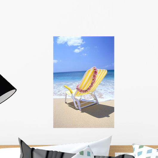 Back View Of Yellow Beach Chair In Sand Wall Mural