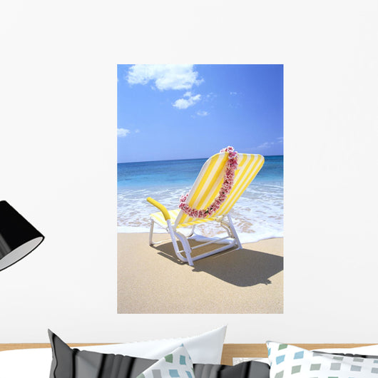 Back View Of Yellow Beach Chair In Sand Wall Mural