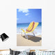 Back View Of Yellow Beach Chair In Sand Wall Mural