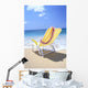 Back View Of Yellow Beach Chair In Sand Wall Mural