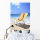 Back View Of Yellow Beach Chair In Sand Wall Mural