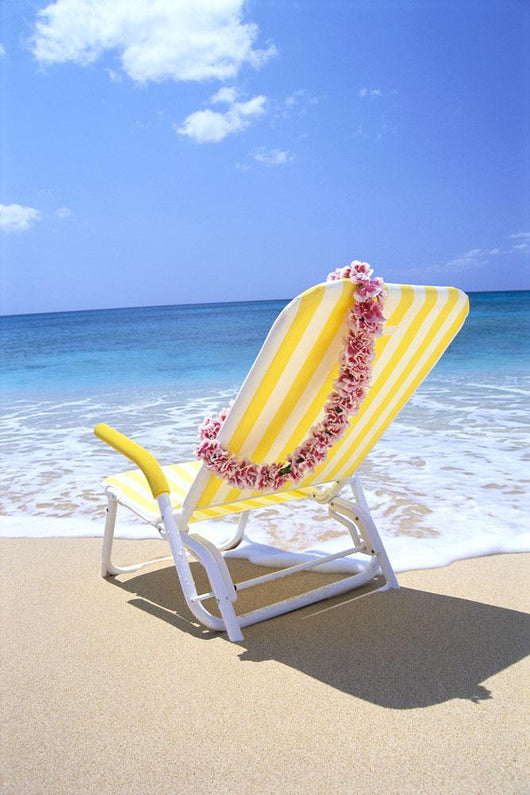 Back View Of Yellow Beach Chair In Sand Wall Mural