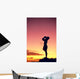 Man Silhouetted At Sunset, Conch Shell Blower Wall Mural