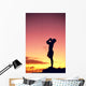 Man Silhouetted At Sunset, Conch Shell Blower Wall Mural