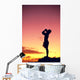 Man Silhouetted At Sunset, Conch Shell Blower Wall Mural