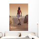 A Young Person Skateboarding With Bare Feet Wall Mural
