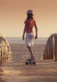 A Young Person Skateboarding With Bare Feet Wall Mural