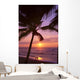 Couple In Distance On Beach Shoreline At Sunset Wall Mural