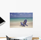 Plumeria Lei Hanging Over Blue Beach Chair Along Shoreline Wall Mural