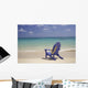 Plumeria Lei Hanging Over Blue Beach Chair Along Shoreline Wall Mural