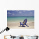 Plumeria Lei Hanging Over Blue Beach Chair Along Shoreline Wall Mural