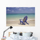 Plumeria Lei Hanging Over Blue Beach Chair Along Shoreline Wall Mural