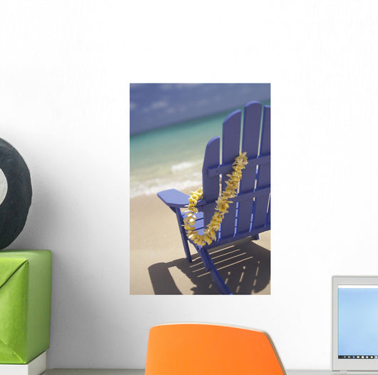 Close-Up Side Of Blue Beach Chair With Plumeria Hanging On Side Wall Mural