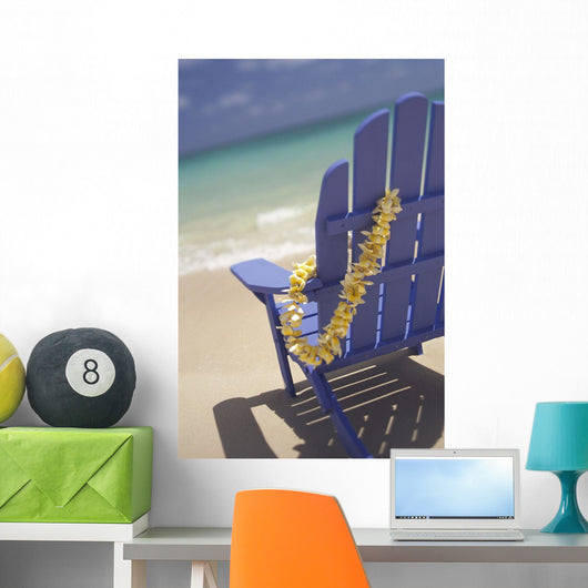 Close-Up Side Of Blue Beach Chair With Plumeria Hanging On Side Wall Mural