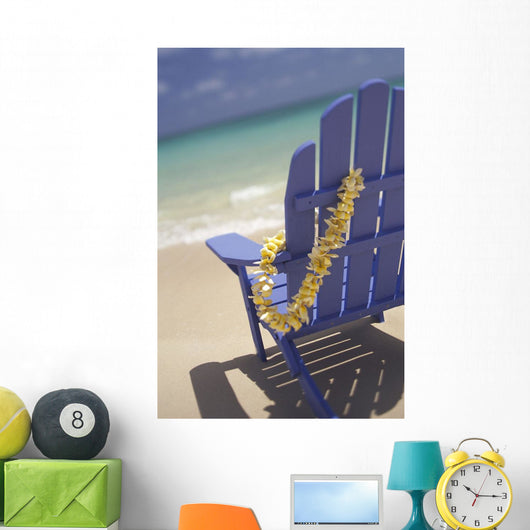 Close-Up Side Of Blue Beach Chair With Plumeria Hanging On Side Wall Mural