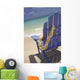 Close-Up Side Of Blue Beach Chair With Plumeria Hanging On Side Wall Mural