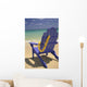 Close-Up Blue Beach Chair With Plumeria Hanging On Side Facing Ocean Wall Mural