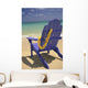 Close-Up Blue Beach Chair With Plumeria Hanging On Side Facing Ocean Wall Mural