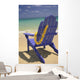 Close-Up Blue Beach Chair With Plumeria Hanging On Side Facing Ocean Wall Mural