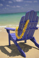 Close-Up Blue Beach Chair With Plumeria Hanging On Side Facing Ocean Wall Mural