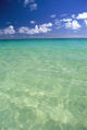 Calm Turquoise Ocean With Sandy Bottom Blue Sky And Clouds Wall Mural