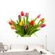 Dutch tulips in glass vase over white background Wall Mural