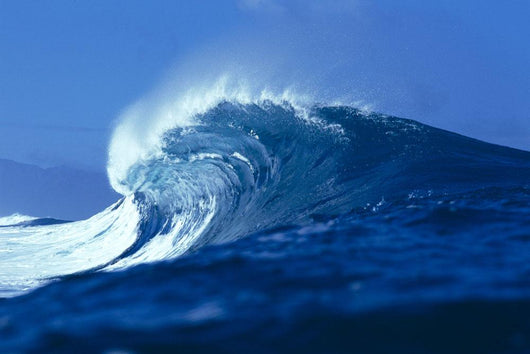 Side Angled View Of Big Blue Wave Curling With Spray, Blue Skies Wall Mural