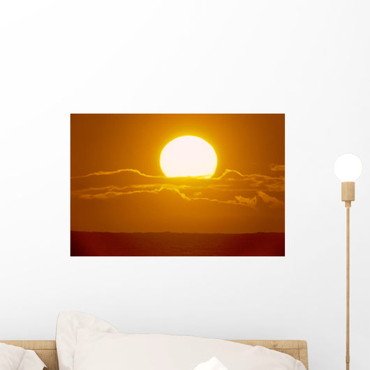 Glowing Sun Ball Partially Covered With Clouds Wall Mural