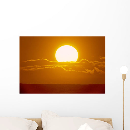 Glowing Sun Ball Partially Covered With Clouds Wall Mural