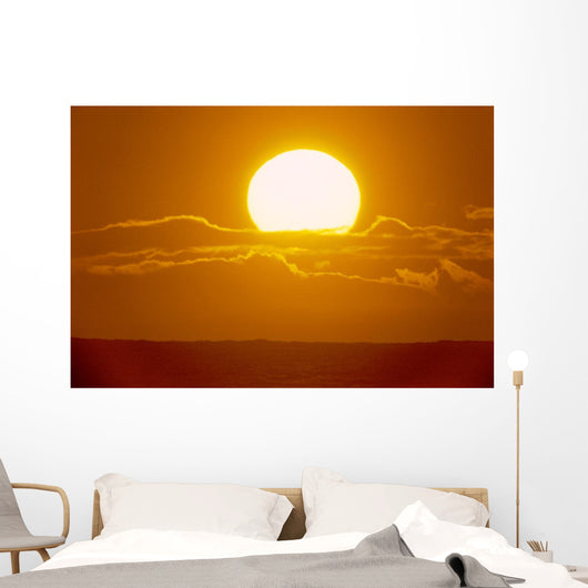Glowing Sun Ball Partially Covered With Clouds Wall Mural