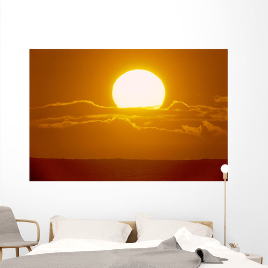 Glowing Sun Ball Partially Covered With Clouds Wall Mural