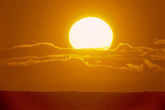 Glowing Sun Ball Partially Covered With Clouds Wall Mural