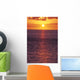 Sunset With Orange Sky Over Ocean Purple Surface With Reflections Wall Mural