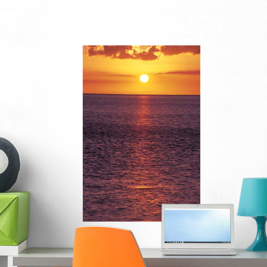 Sunset With Orange Sky Over Ocean Purple Surface With Reflections Wall Mural