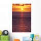 Sunset With Orange Sky Over Ocean Purple Surface With Reflections Wall Mural