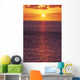 Sunset With Orange Sky Over Ocean Purple Surface With Reflections Wall Mural