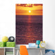 Sunset With Orange Sky Over Ocean Purple Surface With Reflections Wall Mural