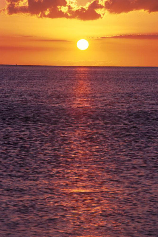 Sunset With Orange Sky Over Ocean Purple Surface With Reflections Wall Mural