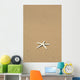 Side View Close-Up Of Single White Starfish On Sandy Beach Wall Mural
