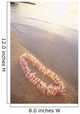 Pale Pink Plumeria Lei Along Shoreline Of Calm Water Wall Mural
