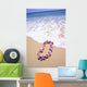 Close-Up Of Pink Lei In Sand On Beach, Foaming Shore Waters, Blue Sky Wall Mural