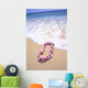 Close-Up Of Pink Lei In Sand On Beach, Foaming Shore Waters, Blue Sky Wall Mural