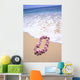 Close-Up Of Pink Lei In Sand On Beach, Foaming Shore Waters, Blue Sky Wall Mural