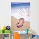 Close-Up Of Pink Lei In Sand On Beach, Foaming Shore Waters, Blue Sky Wall Mural