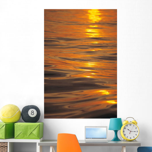 Sunset Orange And Gold Reflections On Smooth Ocean Surface Wall Mural