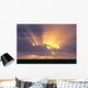 Sunrays Stream Out From Behind Clouds At Sunset, Over Dark Ocean Wall Mural