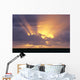 Sunrays Stream Out From Behind Clouds At Sunset, Over Dark Ocean Wall Mural