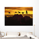 Alaska, Sandhill Crane Flying Above Clouds In Golden Sunset Sky Wall Mural